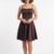 Mannequin portant la robe courte évasée marron foncé 'Cocoa' avec fines bretelles et encolure carrée, de la marque Divine Dress.