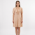 Mannequin portant la robe courte beige 'Cascading' avec col à volants, manches courtes bouffantes et jupe asymétrique, de la marque Divine Dress.